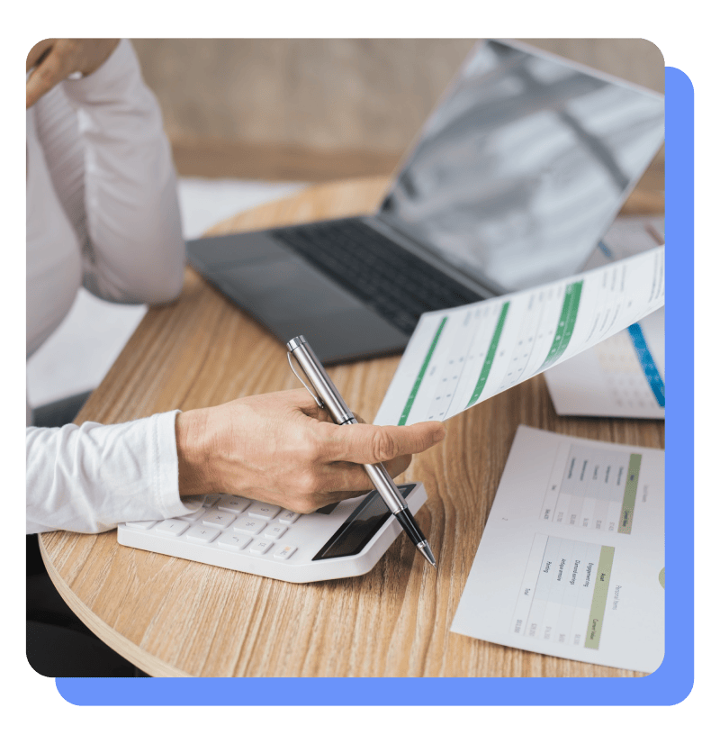 Financial manager holding printed out data for review Financial manager holding printed out data for review