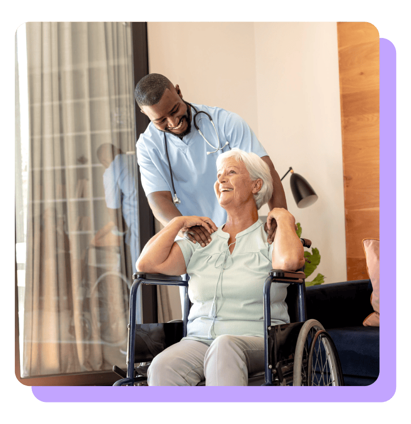 Male assited living employee helping elderly woman