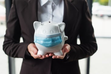 piggy bank with a face mask on