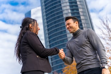 man and woman shaking hands