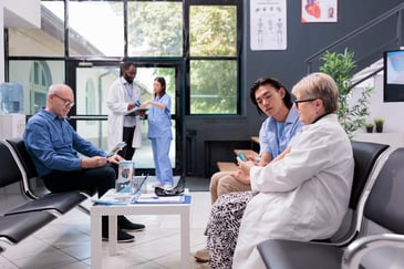 patients sitting in the waiting room at a healthcare facility