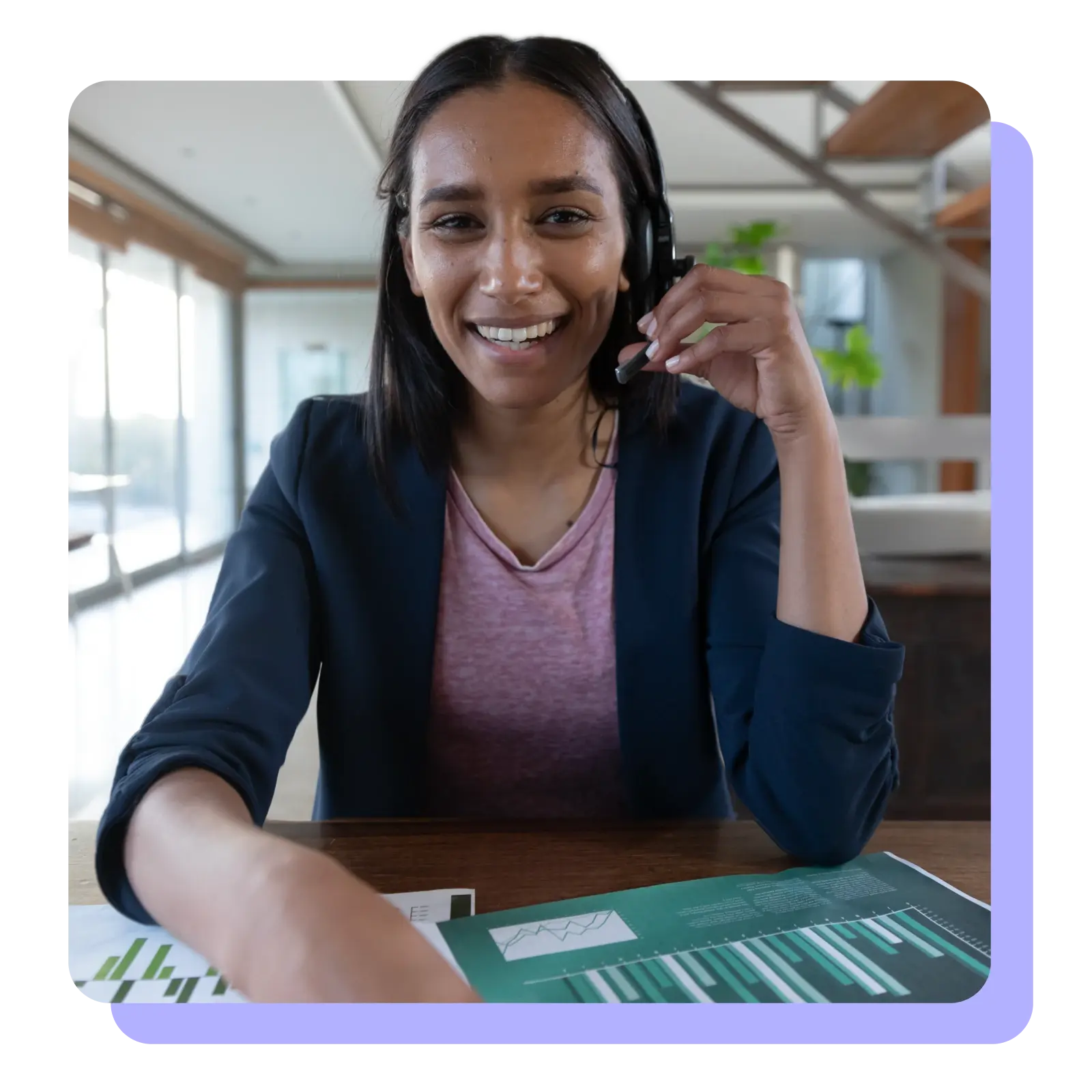 Woman with headset on smiling looking at camera