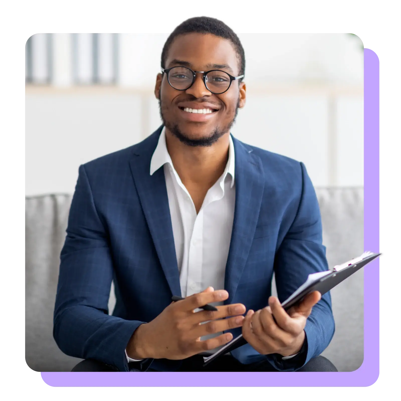 man_smiling_at_camera_with_forms_in_hand